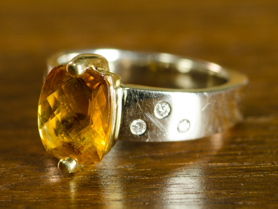 Appraisal: CITRINE DIAMOND AND FOURTEEN KARAT GOLD RING with three round-cut