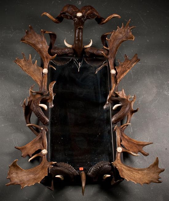 Appraisal: Faux horn and antler-mounted beveled glass mirror in H in