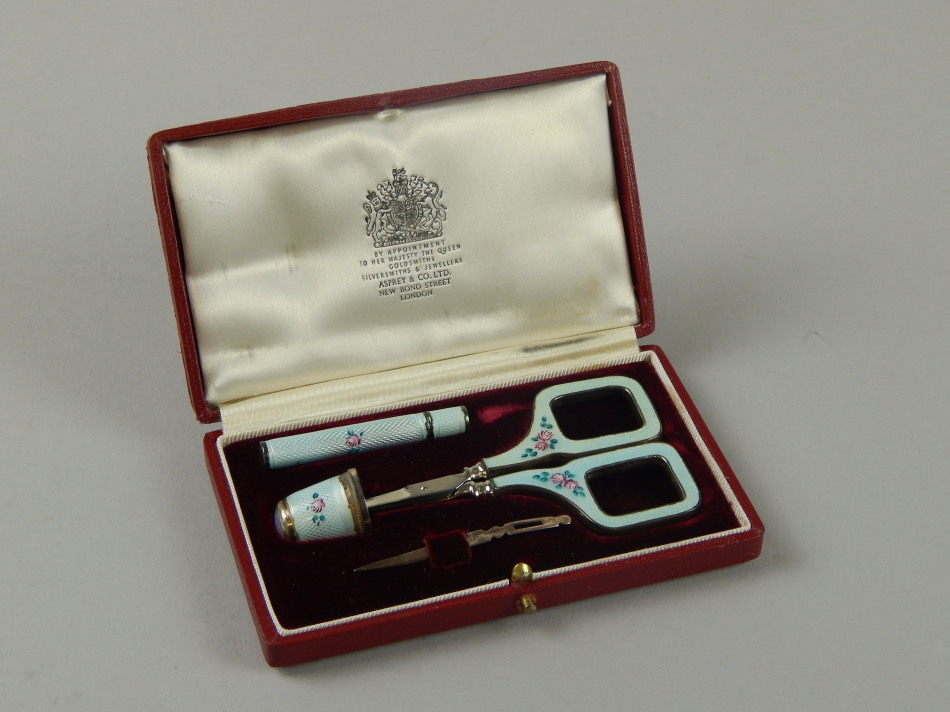 Appraisal: An Asprey silver and enamel sewing set import marks for