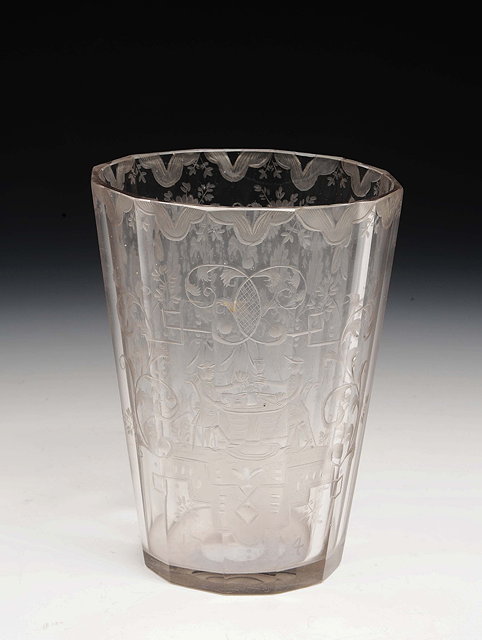 Appraisal: An early Bohemian glass beakerdated engraved 'laub and bandelwerk' and