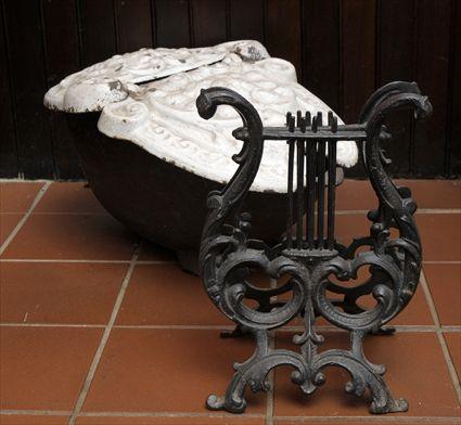 Appraisal: VICTORIAN CAST-IRON COAL SCUTTLE The hinged cover with cast decoration