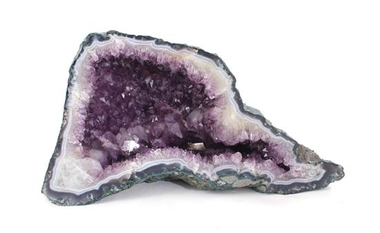 Appraisal: Amethyst geode specimen split exposings calcite and vibrant amethyst H