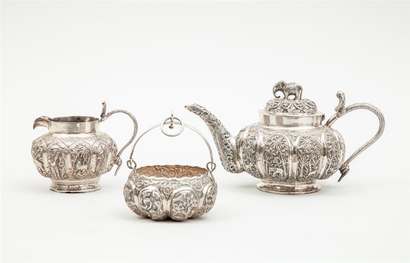 Appraisal: INDIAN REPOUSS SILVER ASSEMBLED THREE-PIECE TEA SET Unmarked the teapot