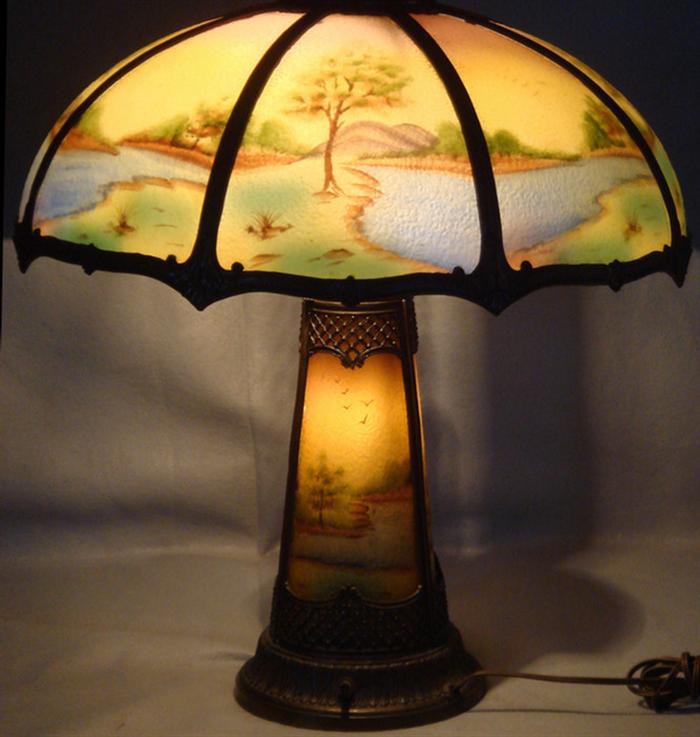 Appraisal: panel reverse painted table lamp depicting forest and stream landscape