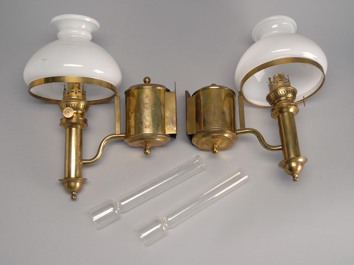 Appraisal: PAIR OF TH CENTURY WALL-MOUNTED BRASS OIL LAMPS Burners in