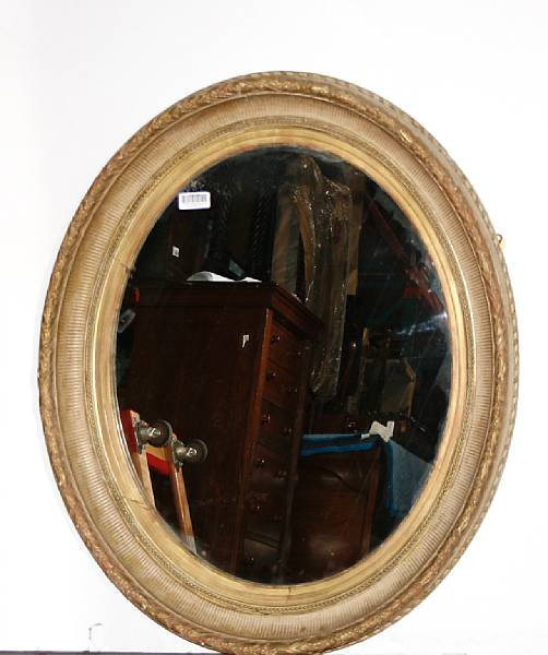 Appraisal: A Neoclassical style giltwood mirror height in depth in