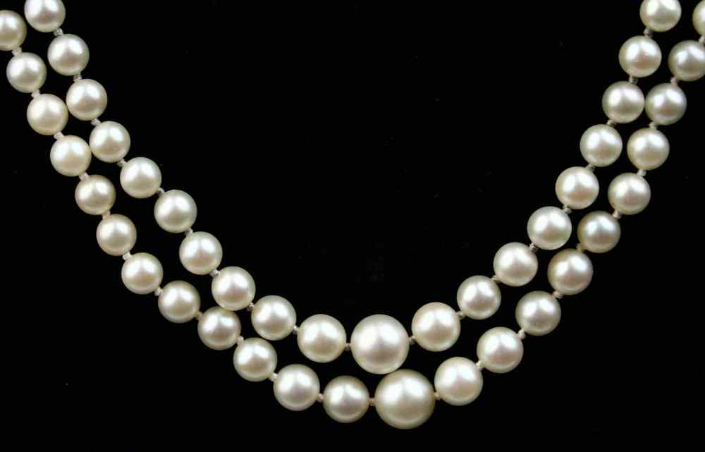 Appraisal: NECKLACE - A double strand of cultured pearls graduating in