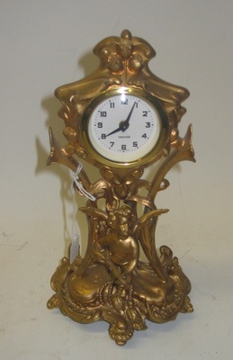 Appraisal: A GERMAN GILT METAL SHELF CLOCK spring wound time piece