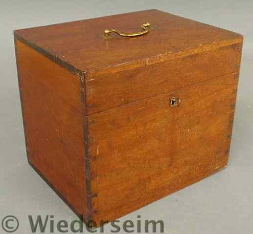 Appraisal: Mahogany storage box th c with a brass handle and