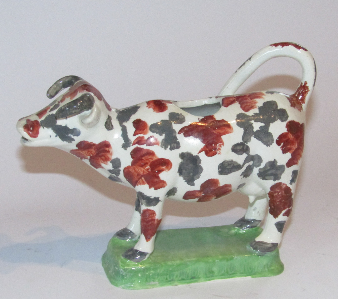 Appraisal: A late thC Yorkshire creamware cow creamer with tail handle