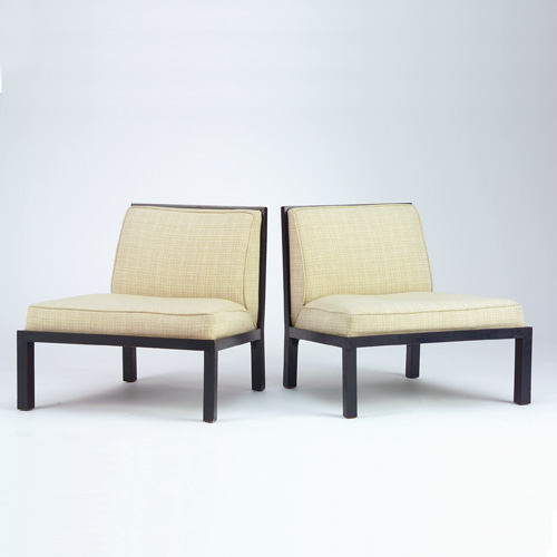 Appraisal: BAKER Pair of ebonized lounge chairs with windowpane backs and