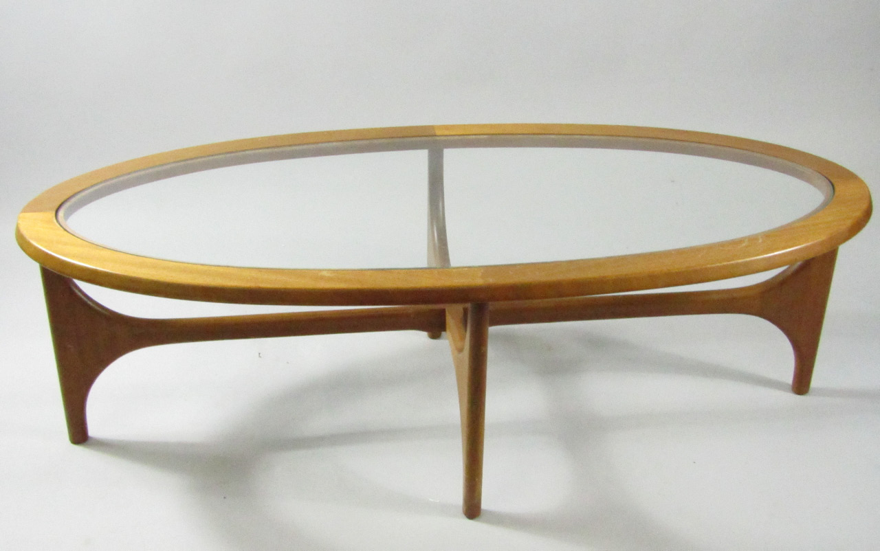 Appraisal: A s oval teak occasional table inset glass top raised