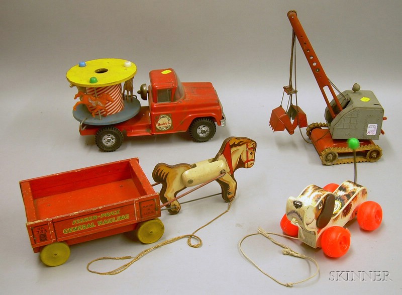 Appraisal: Buddy L Merry-Go-Round Truck a German Digger and Two Fisher-Price