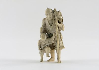 Appraisal: A Japanese ivory carving of a man carrying a large