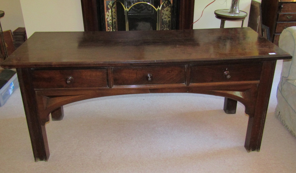 Appraisal: A thC Arts and Crafts walnut serving table with moulded