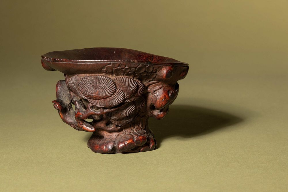 Appraisal: A Chinese Carved Bamboo 'Pine' Libation Cup A Chinese Carved