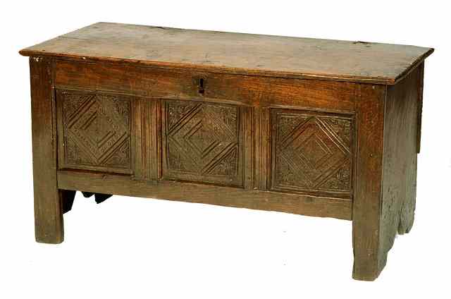 Appraisal: AN ANTIQUE OAK COFFER with hinged rising lid carved triple