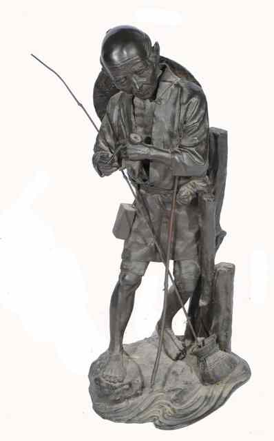 Appraisal: A JAPANESE BRONZE FIGURE of a fisherman standing and pausing