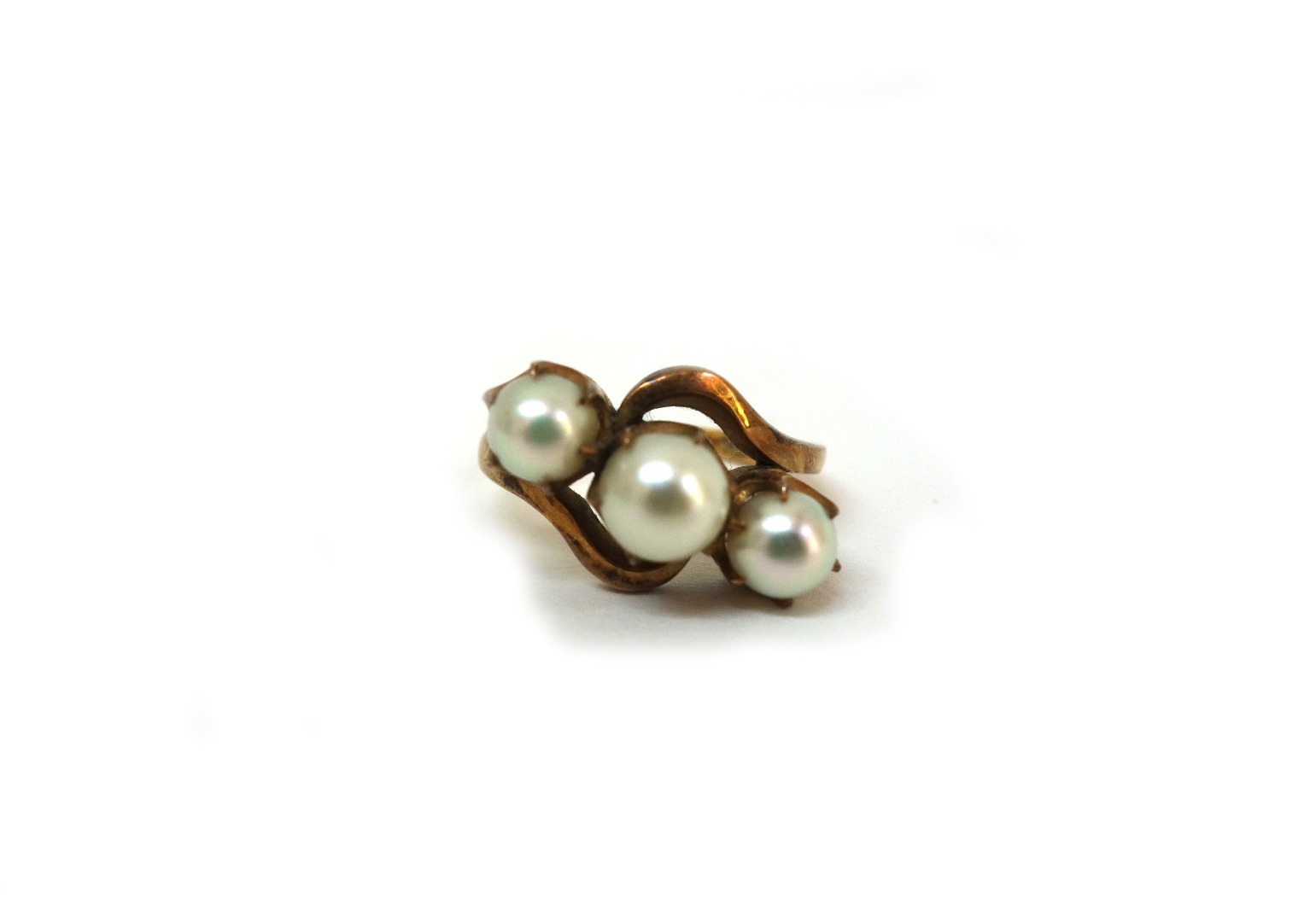 Appraisal: A gold and cultured pearl ring the three beads in