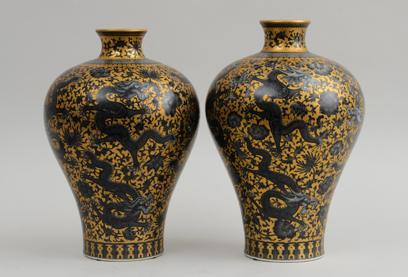 Appraisal: ASSEMBLED PAIR OF CHINESE GOLD-GROUND PORCELAIN DRAGON VASES With pseudo