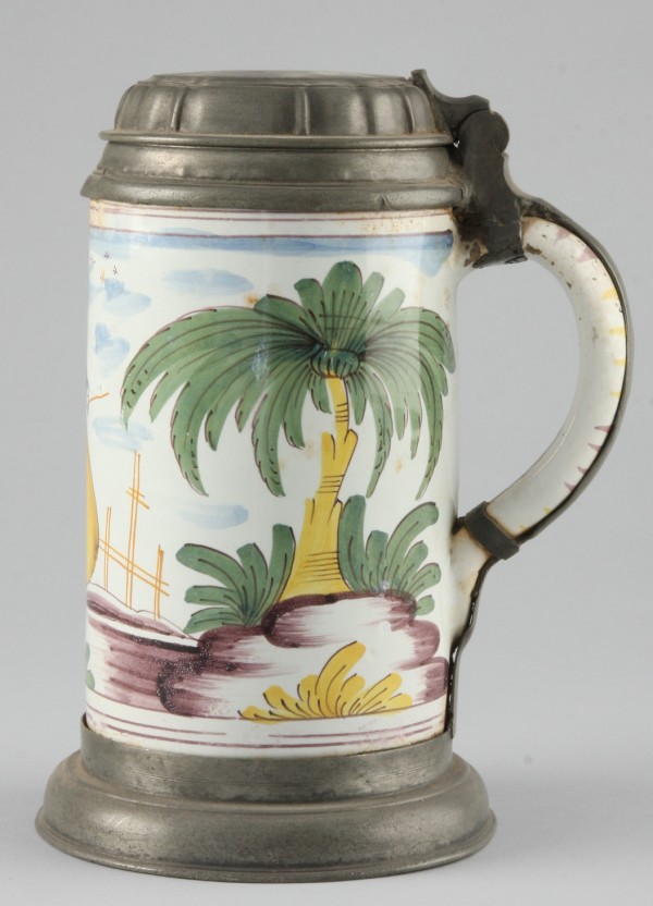 Appraisal: Tankard features woman working in field and decorated handle t