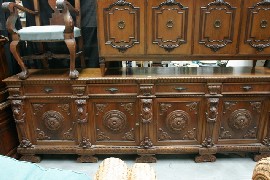 Appraisal: A highly carved sideboard in Italianate taste in walnut with