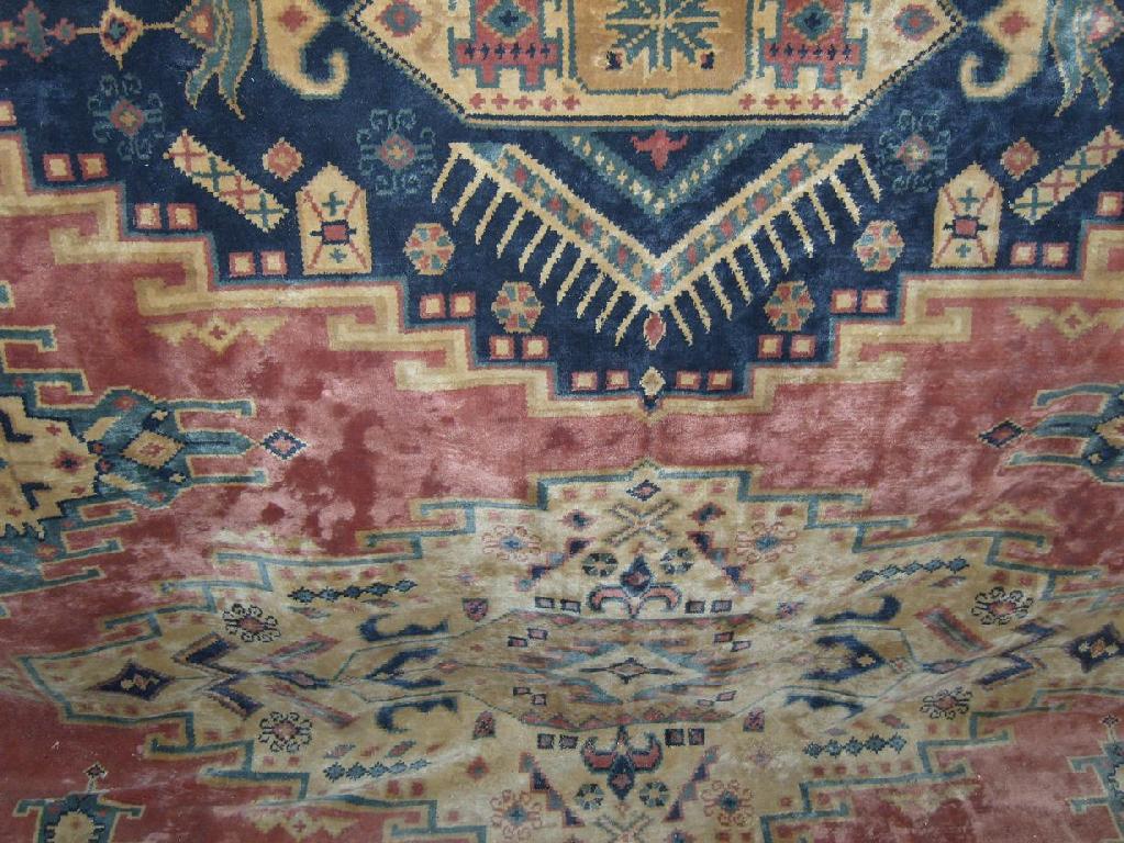 Appraisal: A contemporary wool carpet in a Persian style with brick