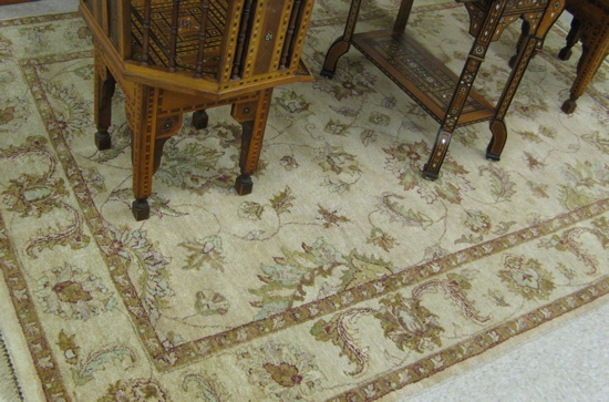 Appraisal: PAKISTANI KASHAN CARPET overall scrolling leafy vine design on buff