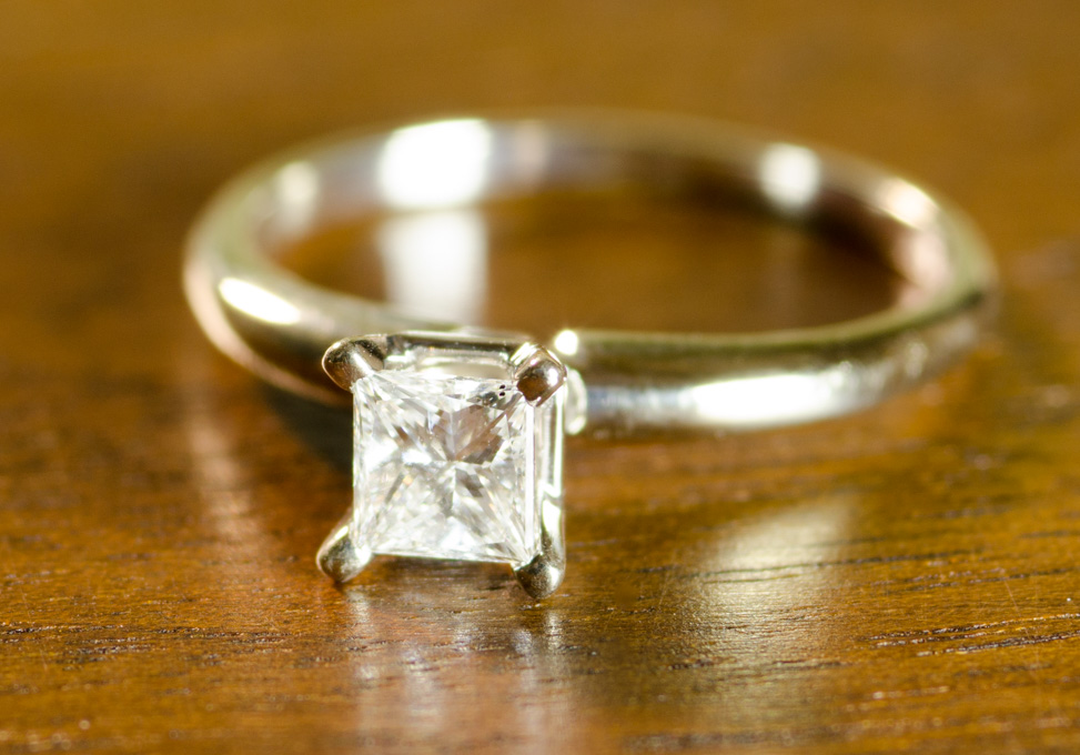 Appraisal: DIAMOND AND FOURTEEN KARAT GOLD SOLITAIRE RING with a white