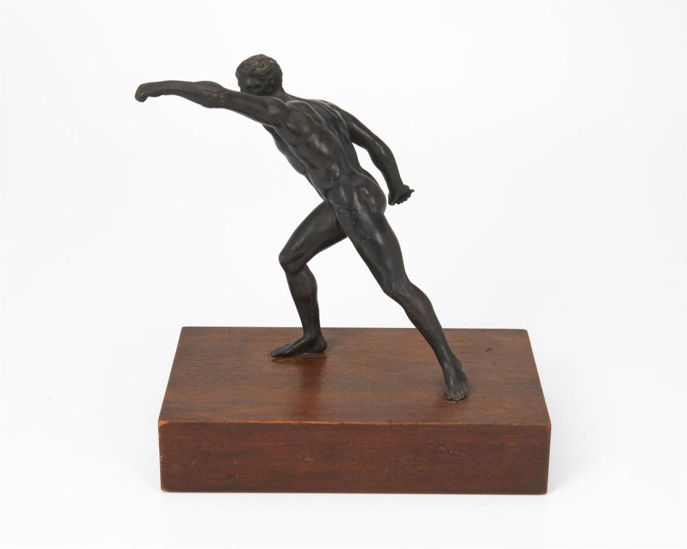 Appraisal: A BRONZE SCULPTURE OF AN ATHLETEA bronze sculpture of an