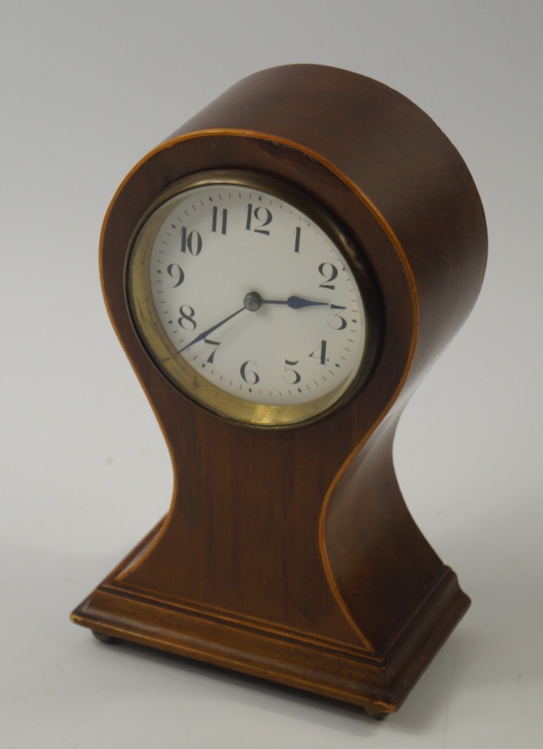 Appraisal: An Edwardian mahogany and boxwood line inlaid balloon mantel clock