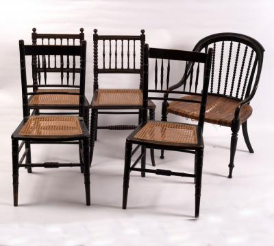 Appraisal: A pair of ebonised spindle back chairs on bobbin turned