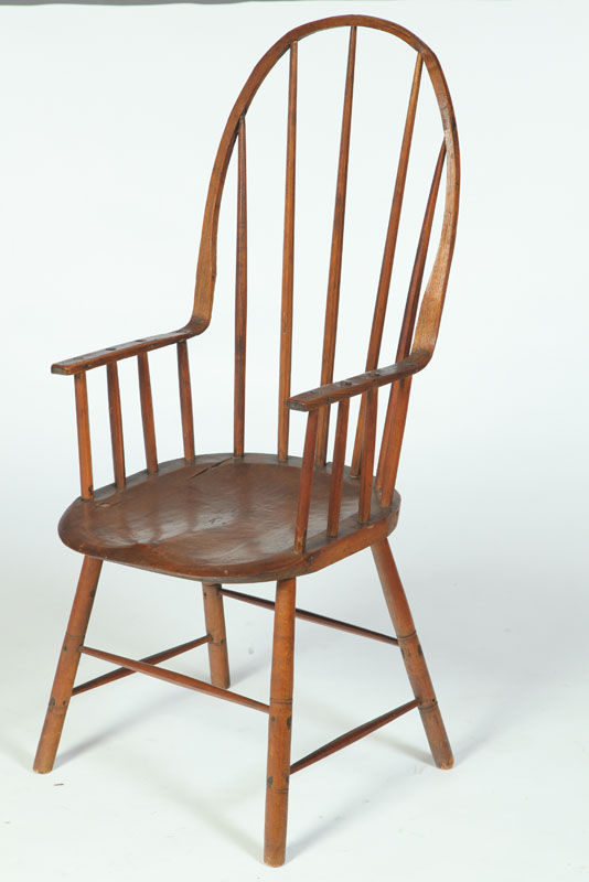 Appraisal: FOLKSY CONTINUOUS WINDSOR ARMCHAIR American early th century mixed woods