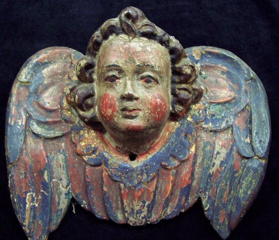 Appraisal: An Austrian carved cherub mask head