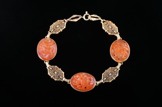 Appraisal: ART DECO K YELLOW GOLD AND CARVED CARNELIAN BRACELET Composed