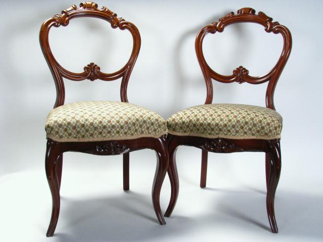 Appraisal: Pair of walnut Victorian chairs with carved open backs and