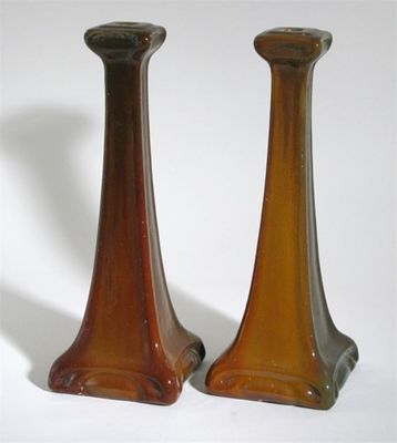 Appraisal: A pair of Carter's Poole Pottery lustre candlesticks deigned by