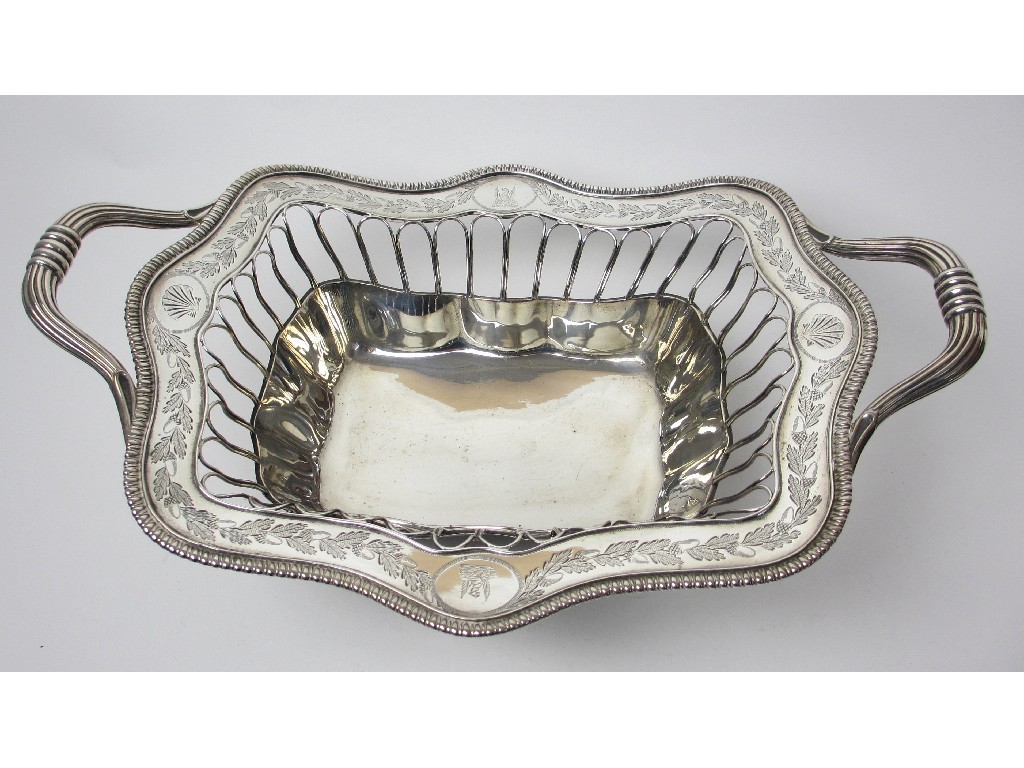 Appraisal: A George III silver twin handled basket of serpentine rectangular