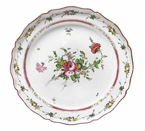 Appraisal: A Continental Faience Charger centered with a polychrome floral spray