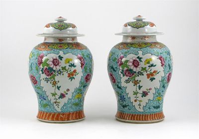 Appraisal: A pair of Chinese famille rose ovoid vases and covers