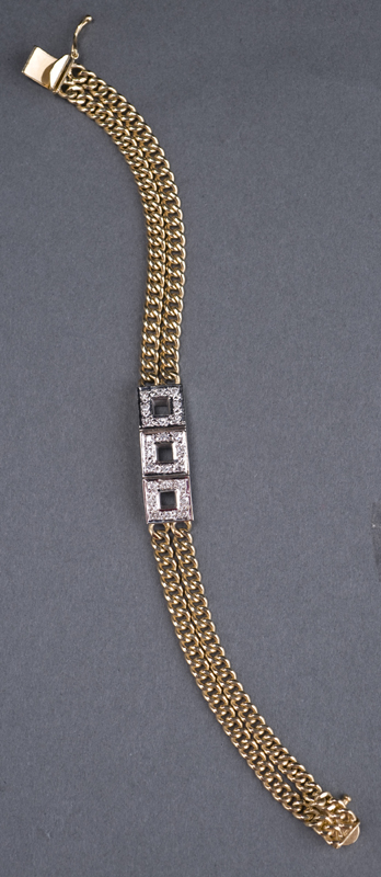 Appraisal: KT two-tone diamond bracelet In the center are KT white