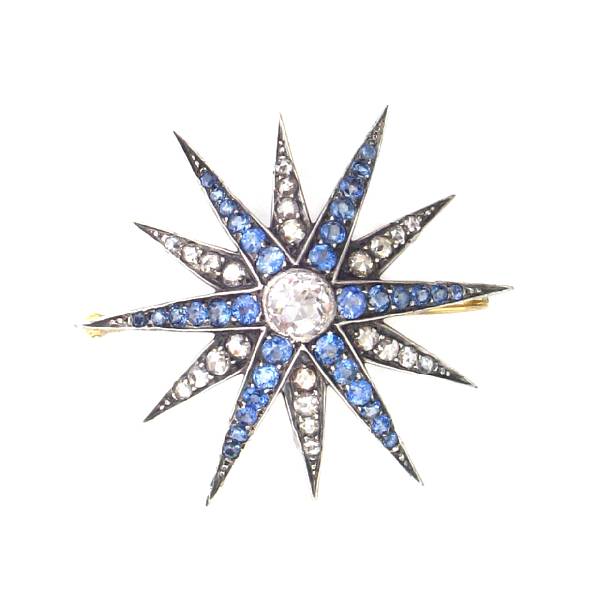 Appraisal: A sapphire diamond crystal and silver-topped nine karat gold brooch