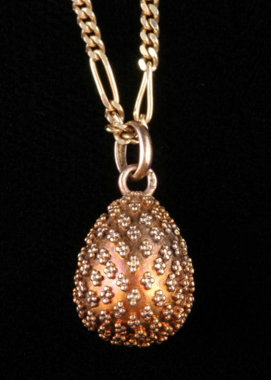 Appraisal: YELLOW GOLD EGG PENDANT ON ITALIAN K GOLD CHAIN Egg