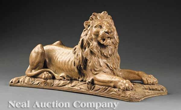 Appraisal: A French Carved Wood Figure of a Lion at Rest