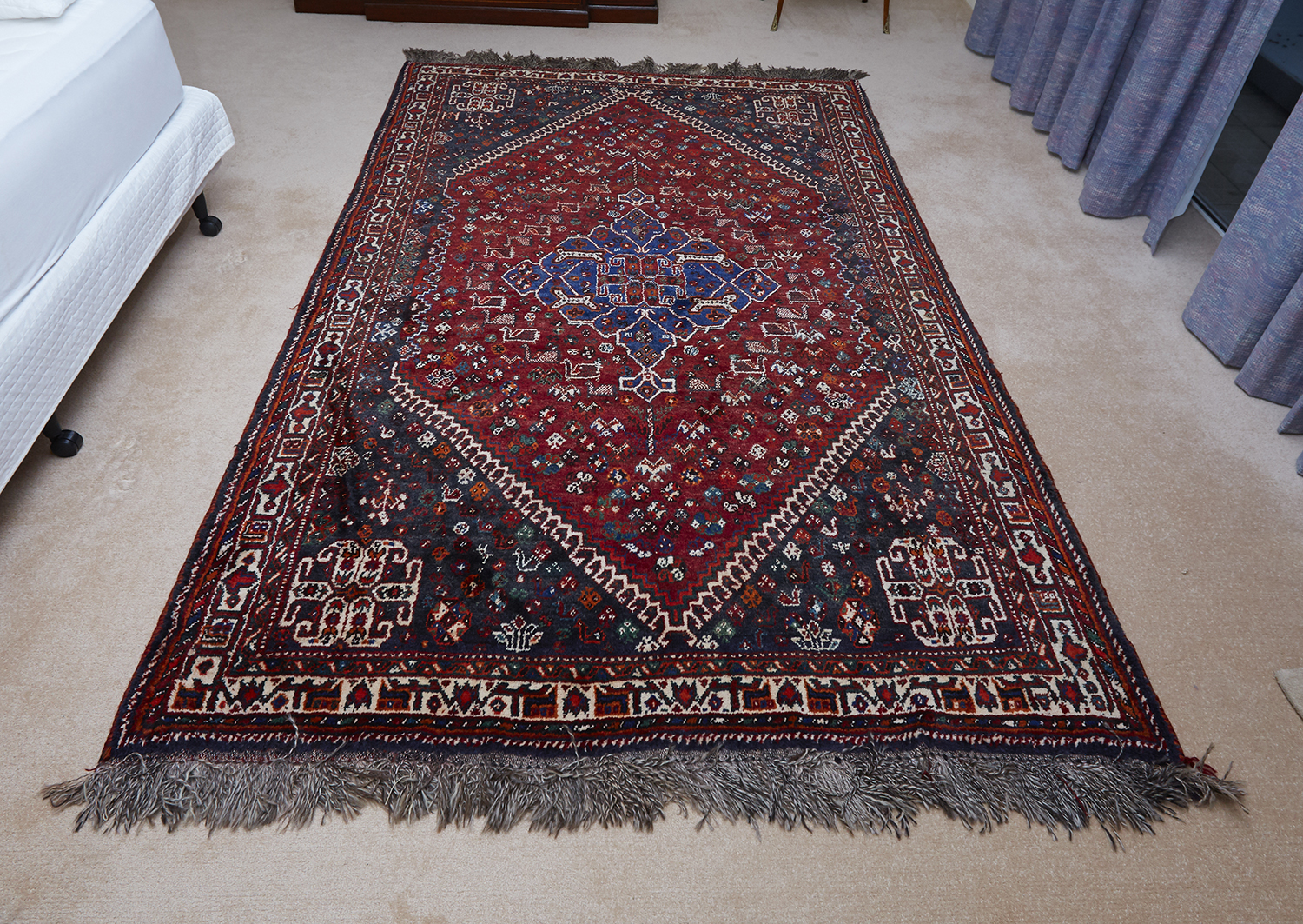 Appraisal: A HAND KNOTTED TURKISH WOOL RUG Of central medallion design