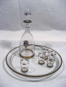 Appraisal: A French silver mounted decanter set comprising tray decanter and