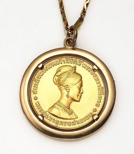 Appraisal: A Thai gold coin and k gold pendant with chain