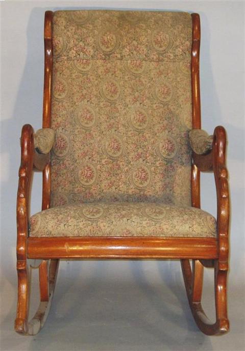 Appraisal: VICTORIAN STYLE CARVED MAHOGANY ROCKER Early th century the padded