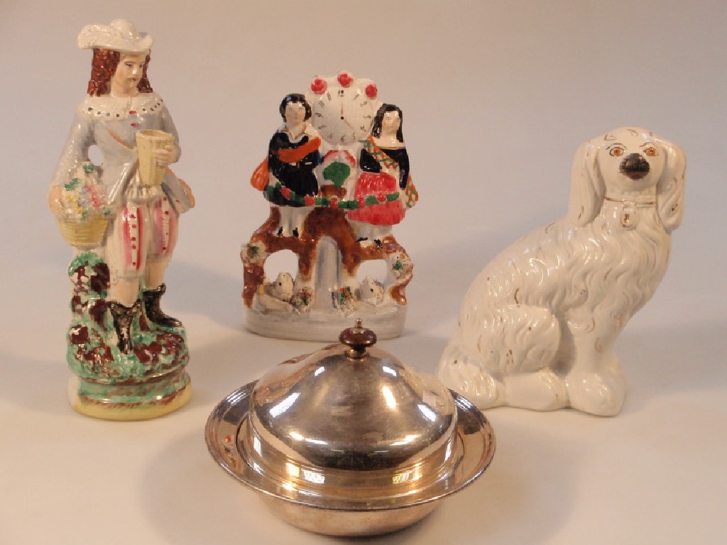 Appraisal: A Staffordshire pottery figural clock group cm high a Staffordshire