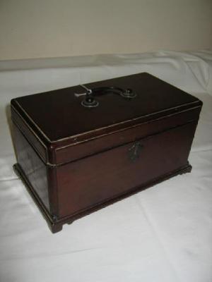 Appraisal: A GEORGE III MAHOGANY TEA CADDY of oblong form the